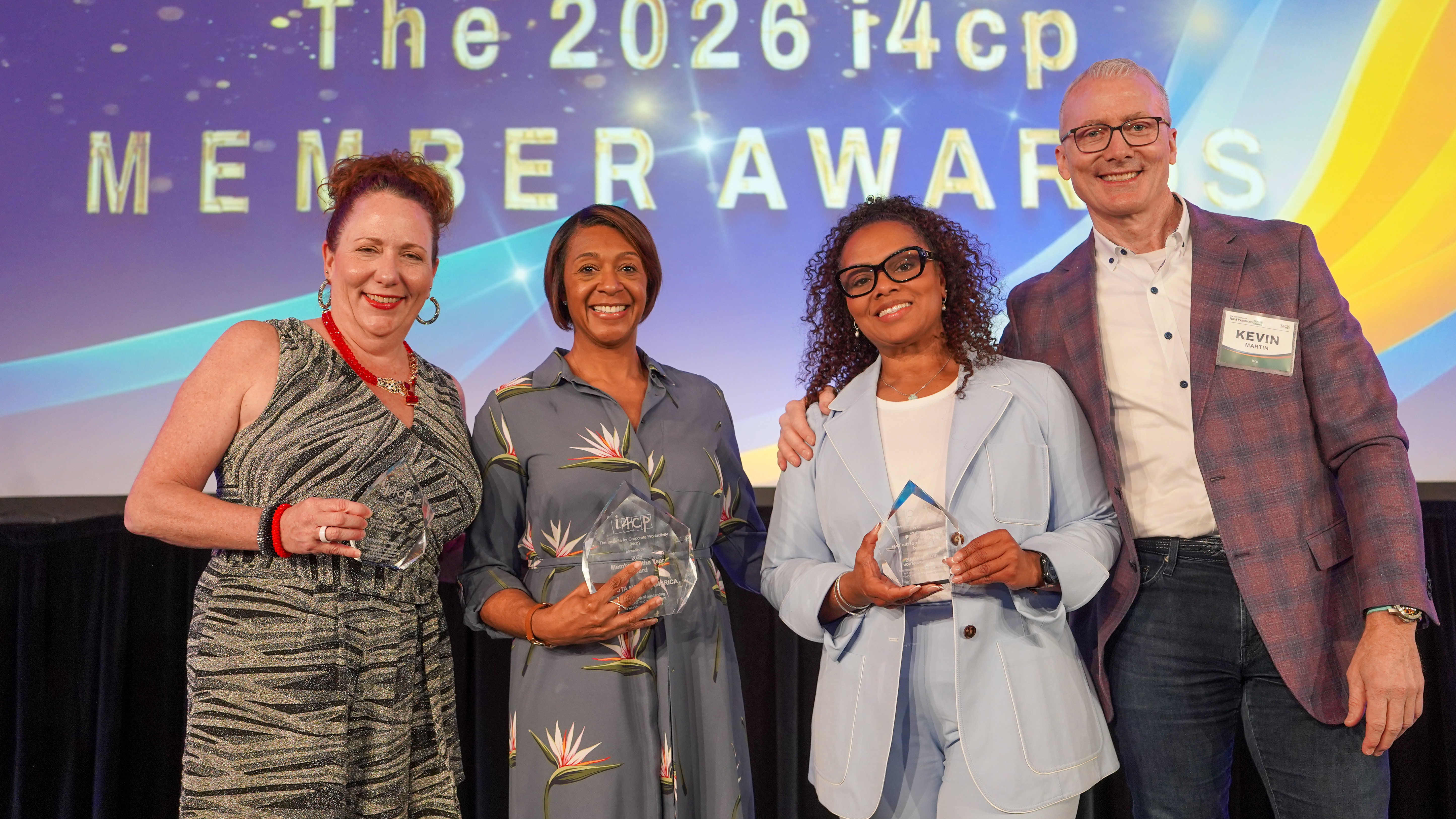 Winners and presenters together on stage at the i4cp Member Awards