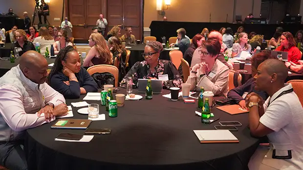 HR leaders talking at the i4cp conference